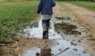 Child playing in puddles