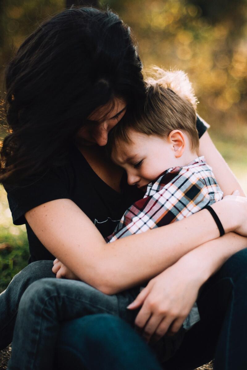 Mother and child hugging