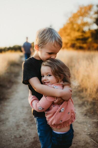 Little boy and girl hugging