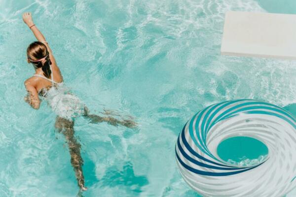 kid swimming in pool