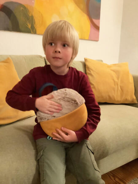 Boy with inmuJOY on sofa