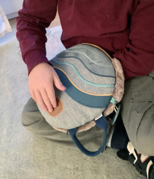 Child holding inmuJOY