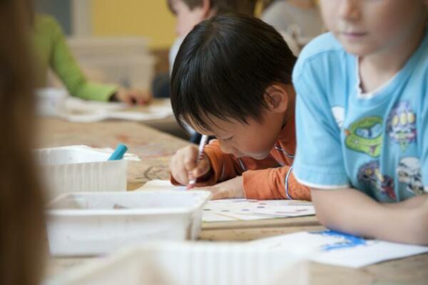 Little boys writing in school