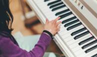 Childs hands on keyboard