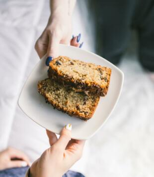 Banana Bread on plate with Hands