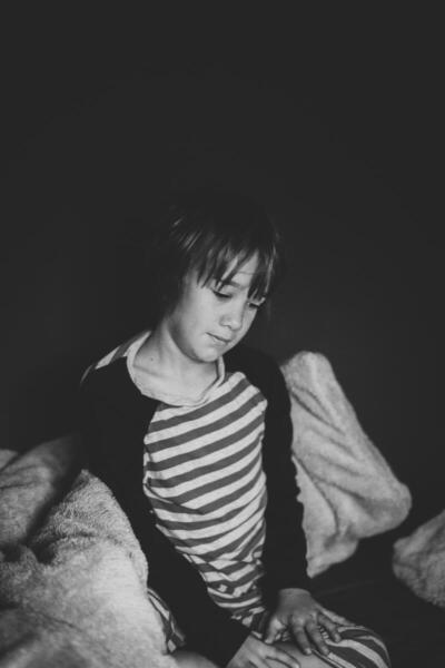 Liile boy with striped shirt, black and white photo